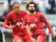 Liverpool's Mohamed Salah (right) and Virgil van Dijk warm up before last week's match.