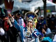 Dancer Beany John takes part in Alberta's first ever 2-Spirit pow wow, in Edmonton's Churchill Square Thursday, Aug. 24, 2023.