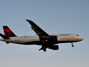 A Delta airlines Airbus 320 approaches Ronald Reagan Washington National Airport in Arlington, Va., on Dec. 24, 2022. Eleven airline passengers and crew were hospitalized Aug. 29, 2023 following severe turbulence on a Delta flight from Milan to Atlanta, the U.S.-based airline said.