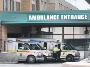 A paramedic and ambulances are shown at the Windsor Regional Hospital Met Campus on Wednesday, January 8, 2020. (/)