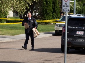 A file photo of an ASIRT investigator at a scene in Edmonton in 2021. Two cases involving police officers in Lethbridge and Lloydminster were tossed this week after Crown prosecutors said Alberta's police watchdog took too long to investigate.