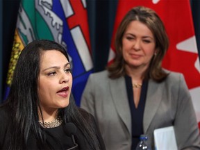 Advanced Education Minister Rajan Sawhney, left, with Premier Danielle Smith.