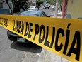 Forensic personnel work at the crime scene of a clandestine grave located inside a house in Guadalajara, Jalisco State, Mexico on August 5, 2018.
