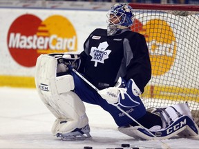 Goalie Jonathan Bernier stretches as the Toronto Maple Leafs practice at the Mastercard Centre in Toronto on Thursday March 27, 2014.