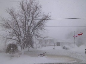 A home covered with snow during a winter storm near Wainfleet Ont., Saturday, Dec. 24, 2022.