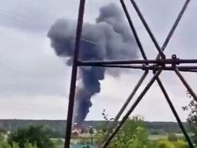 This video grab taken from a footage posted on a Wagner linked Telegram channel @grey_zone on August 23, 2023 and which can not be independetly verified by the AFP, reportedly shows a plane wreckage falling from the sky near the village of Kuzhenkino, Tver region.