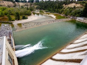 Minimal water passes through the Glenmore Dam while the city keeps the reservoir near capacity as drought conditions persist in southern Alberta on Monday, Aug. 21, 2023.