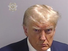 This booking photo provided by Fulton County Sheriff's Office, shows former President Donald Trump on Thursday, Aug. 24, 2023.