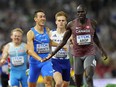 Marco Arop cruised into the men's 800-metre semifinals on Tuesday at the World Athletics Championships.&ampnbsp;Arop and Simone Barontini, of Italy touch hands as they approach the finish of a Men's 800-meters heat during the World Athletics Championships in Budapest, Hungary, Tuesday, Aug. 22, 2023.