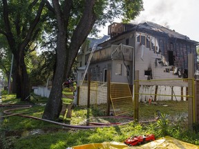 Firefighters work to control the fire in a house at 9529 103 Avenue on Wednesday, Aug. 2, 2023 in Edmonton. Firefighters were called to a house fire in central Edmonton early Wednesday morning at around 5:35 am. The crews had the fire out just before 7 a.m. Greg Southam-Postmedia