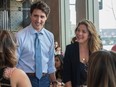 Prime Minister Justin Trudeau and his wife Sophie Grégoire Trudeau interact with people in a coffee shop