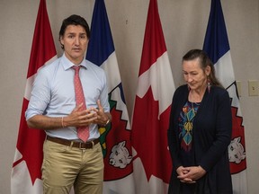 Prime Minister Justin Trudeau and N.W.T. Premier Caroline Cochrane meet in Edmonton on Saturday, Aug. 26, 2023.