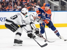 Los Angeles Kings' Sean Durzi (50) and Arthur Kaliyev (34) try to stop Edmonton Oilers' Connor McDavid (97) during second period NHL Stanley Cup first round playoff action in Edmonton on Wednesday April 19, 2023. Player agent Jeff Jackson, whose client list included superstar McDavid, has been named CEO of hockey operations for the Edmonton Oilers, the team announced Thursday.THE CANADIAN PRESS/Jason Franson