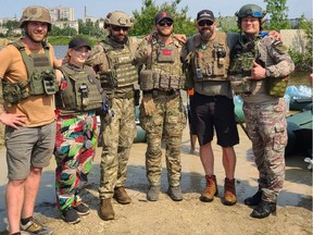 Albertan Cory Woods (second from right) with soldiers and fellow aid workers in Kherson region earlier this summer. Photo courtesy of Cory Woods.