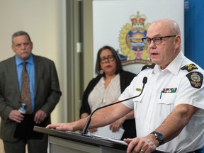 Edmonton city council is set to vote on the Edmonton Police Service's proposed funding formula. City manager Andre Corbould, left, Bent Arrow Traditional Healing Society executive director Cheryl Whiskeyjack and Edmonton Police Service Chief Dale McFee at a news conference on March 15, 2023.