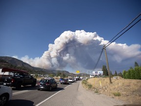 Smoke from the McDougall Creek wildfire is seen from Westbank, B.C., Thursday, Aug. 17, 2023.