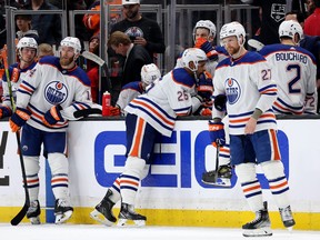 The Edmonton Oilers wait for a review of a goal by the Los Angeles Kings.