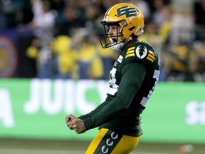 Edmonton Elks' place kicker Dean Faithfull yells in celebration, fists clenched in front of him