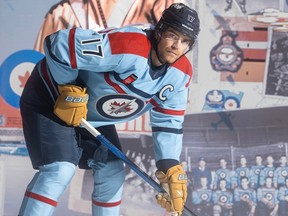 Winnipeg Jets captain Adam Lowry shows off the Winnipeg Jets 1948 RCAF jersey, a special alternate jersey for the 2023-24 season in honour of the Royal Canadian Air Force (RCAF) Centennial. Nicknamed "the Forty-Eight", the jersey is a collaboration between the Winnipeg Jets, adidas, the RCAF and the NHL and pays homage to the 1948 jerseys worn by the gold-medal winning RCAF Flyers. Players will premiere the Forty-Eight on ice at Canadian Armed Forces Appreciation Night Monday, Dec. 4 vs. Carolina – a game which will serve as a kickoff for the RCAF's centennial celebrations. The jerseys will be worn for two additional home games: Saturday, Jan. 27 vs. Toronto and Monday, April 1 vs. Los Angeles, which marks the actual 100th anniversary of the RCAF.