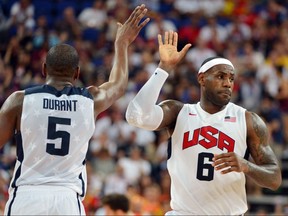 U.S. forward Kevin Durant (L) and U.S. forward LeBron James (R) high-five during the London 2012 Olympic Games men's gold medal basketball game between USA and Spain.