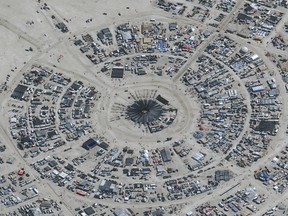 This handout satellite image courtesy of Maxar Technology shows an overview of the annual Burning Man festival underway in Nevada's Black Rock desert on August 29, 2023.