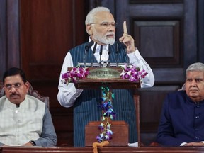 This handout photograph taken on September 19, 2023 and released by the Indian Press Information Bureau (PIB) shows India's Prime Minister Narendra Modi (C) addressing Members of Parliament at the Central Hall of the Old Parliament building in New Delhi.