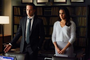 Patrick J. Adams as Mike Ross and Meghan Markle as Rachel Zane on Suits.