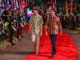 Canada's Prime Minister Justin Trudeau (R) and his son Xavier Trudeau arrive for the gala dinner of the 43rd ASEAN Summit in Jakarta on September 6, 2023.