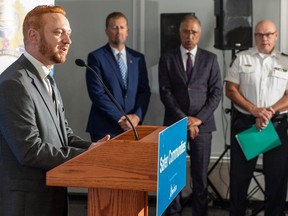 Justice Minister Mickey Amery, left, speaks as Public Safety and Emergency Services Minister Mike Ellis, Mayor Amarjeet Sohi, and police Chief Dale McFee listen to an announcement about measures that address violent crime on Monday, Sept. 11, 2023, in Edmonton.