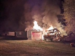 RCMP are investigating an arson fire Sept. 9, 2023, which included the words "GO HOME" scrawled on a garage.