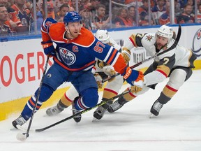 Connor McDavid (97)of the Edmonton Oilers, fends off Alec Martinez of the Las Vegas Golden Knights in Game 6 of the second round of the NHL playoffs at Rogers Place in Edmonton on May 14, 2023.