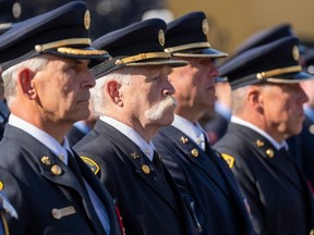 Firefighters honour the active and retired members of Edmonton Fire Rescue Services who have passed away in the last year on Monday, Sept. 11, 2023, in Edmonton.