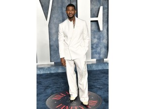 FILE - Usher arrives at the Vanity Fair Oscar Party on Sunday, March 12, 2023, at the Wallis Annenberg Center for the Performing Arts in Beverly Hills, Calif. The NFL, Apple Music and Roc Nation announced Sunday that Usher will headline the 2024 Super Bowl on Feb. 11 at Allegiant Stadium. The music megastar, who has won eight Grammys, said he's looking forward to performing on the NFL's biggest stage.