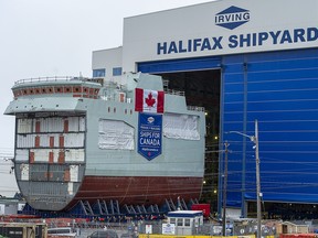 The centre block of the future HMCS Max Bernays is moved from the fabrication building to dockside at the Irving Shipbuilding facility in Halifax on Friday, Jan. 22, 2021.
