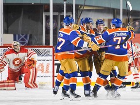 Vincent Desharnais of the Edmonton Oilers celebrates scoring against goaltender Jacob Markstrom of the Calgary Flames.