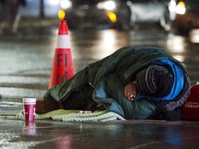 A homeless person is seen in downtown Toronto on Jan. 3, 2018.