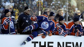 Edmonton-November 22, 2003-#99 Wayne Gretzky leaps off the bench to join the play during the Heritage Classic hockey game at Commonwealth Stadium Saturday. Photo Ed Kaiser/Edmonton Journal/CanWest News Service. HERITAGE HOCKEY LONGREAD