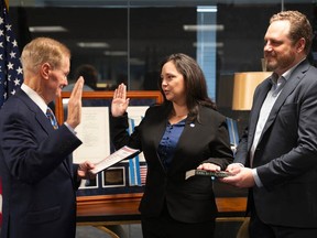 Charity Weeden, centre, is sworn in as associate administrator for NASA's Office of Technology, Policy, and Strategy by NASA Administrator Bill Nelson, Monday, Sept. 25, 2023, at the Mary W. Jackson NASA Headquarters building in Washington.