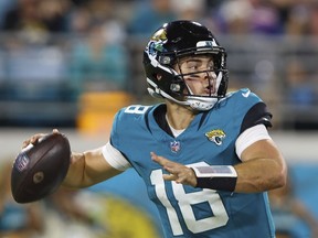 Jacksonville Jaguars quarterback Nathan Rourke (18) in action during an NFL pre-season football game against the Miami Dolphins, Saturday, Aug. 26, 2023, in Jacksonville, Fla. Canadian Rourke has been elevated to the Jaguars active roster.