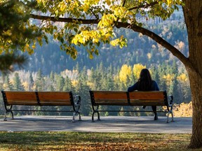 A person relaxes in Grant Notley Park on Monday, Oct. 9, 2023 in Edmonton.Greg Southam-Postmedia
