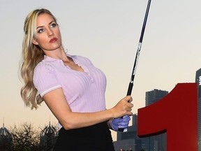 Paige Spiranac poses for photographs on Day One of the Omega Dubai Moonlight Classic at Emirates Golf Club in 2019.