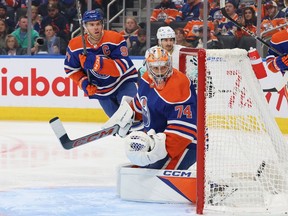 Stuart Skinner (74) and Connor McDavid (97) of the Edmonton Oilers face the Seattle Kraken at Rogers Place on Nov. 15, 2023, in Edmonton.