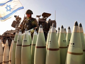 An Israeli soldier arranges artillery shells at a position near the border with the Gaza Strip in southern Israel on Nov. 6, 2023 amid the ongoing battles between Israel and the Palestinian group Hamas in the Gaza Strip.