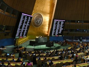 A general view shows a screen of votes during a United Nations General Assembly meeting to vote on a non-binding resolution demanding "an immediate humanitarian ceasefire" in Gaza at UN headquarters in New York on December 12, 2023.