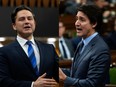 A composite of two images. Leader of the Conservative Party Pierre Poilievre (left) and Prime Minister Justin Trudeau during Question Period, Wednesday, November 29, 2023 in Ottawa. THE CANADIAN PRESS/Adrian Wyld