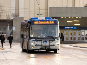 An ETS bus pulls away from Coliseum Station.