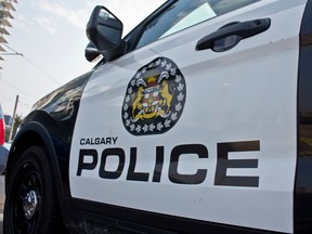 Calgary police logo on teh driver's side door of a police cruiser