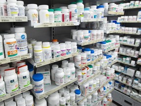 Prescription drugs are seen on shelves at a pharmacy in Montreal on March 11, 2021.