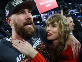 Taylor Swift hugs Travis Kelce during post-game celebration on the football field
