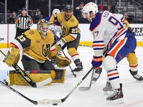 Adin Hill #33 of the Vegas Golden Knights defends the net against Connor McDavid #97 of the Edmonton Oilers in the first period of their game at T-Mobile Arena on February 06, 2024 in Las Vegas, Nevada.
